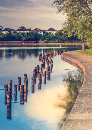 Boating lake in Poole Park on a clear calm eveningの写真素材