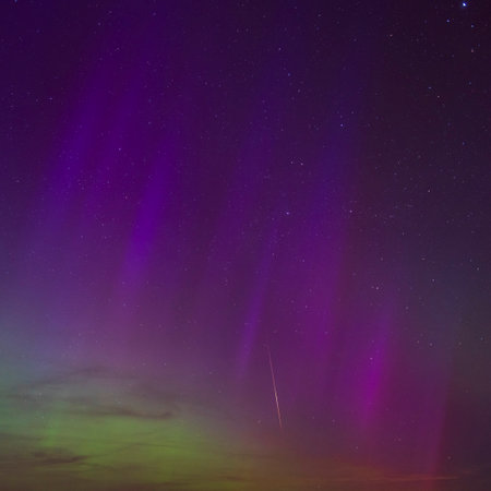 Rare multi-coloured aurora borealis in the starry night skies in Dorset