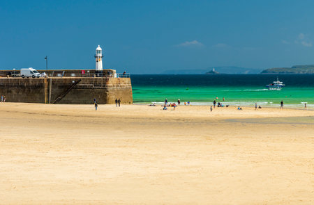 Looking across the beach in St Ives in Cornwall south west England on a sunny summer dayの写真素材