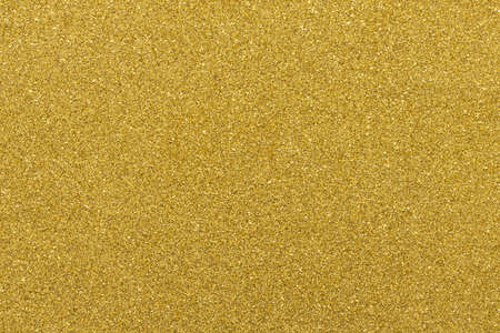 Gold festive background, macro, texture close-up. Copy space for text. Horizontal or vertical. Celebration, holidays, sales, fashion concept, harvesting for mock up.の写真素材