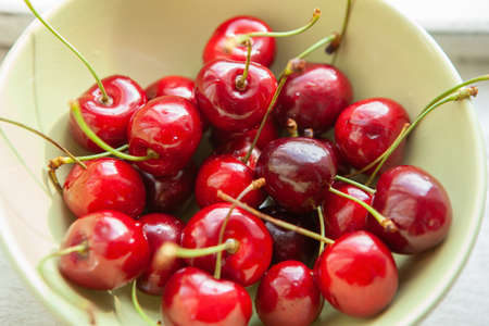 Juicy, ripe, fresh, red cherries in bowl, close-up. Concept healthy food, nutrition, vegetarianism,...