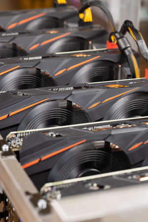 Cryptocurrency mining farm, extraction of bitcoins, ethereum. Fans spinning on video cards, close-up, macro. Selective soft focus. Digital money concept, e-commerce, alternative currency, blockchain.の写真素材