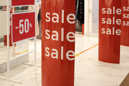 Entrance lobby to store, decorated for seasons of discounts, 50% off discount, with inscription Sales. Fashion concept, discount season, black friday, offline shopping, gimmicks, holiday sales.の写真素材