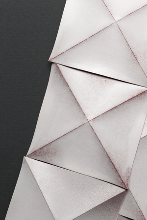 White paper sheets folded in geometric shapesの写真素材