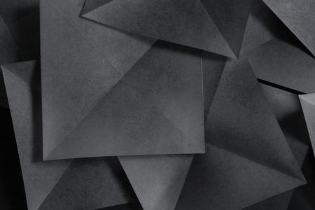 Geometric shapes of paper, grey backgroundの写真素材