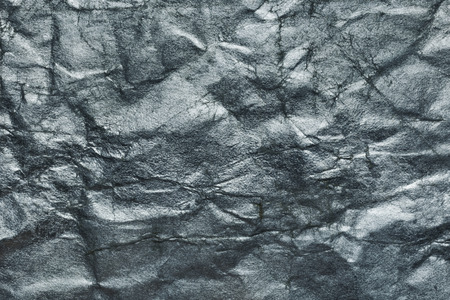 Sheet of silver paper crumpled, abstract backgroundの写真素材