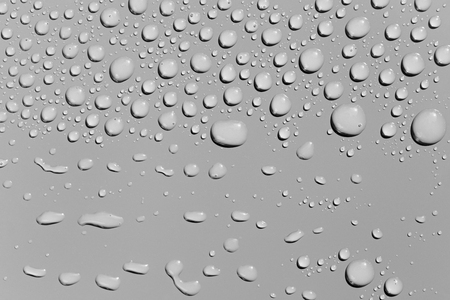 Water drops on a  grey surface, backgroundの写真素材