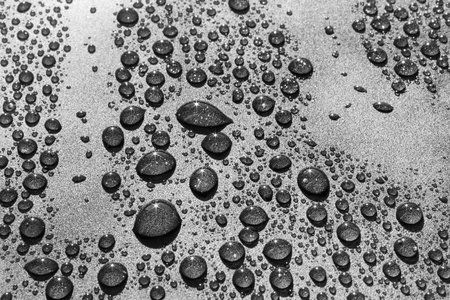 Water drops on a rough surface, texture backgroundの写真素材
