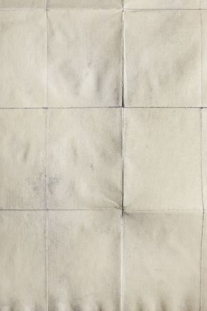 Folded old sheet of paper, background textureの写真素材
