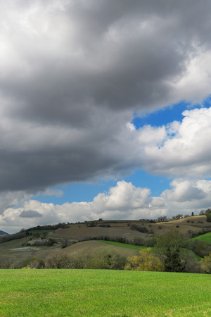 Countryside landscape on a spring day, cloudy skyの写真素材