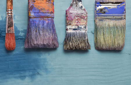 Tools for painters, set of paint brushes on rustic boardの写真素材