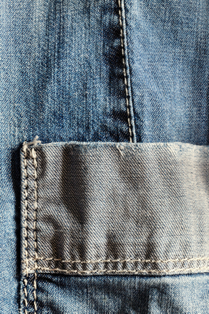 Empty pocket of a jeans shirt, closeupの写真素材