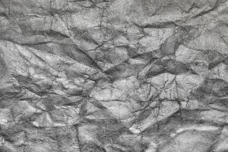 Sheet of silver paper crumpled, abstract backgroundの写真素材