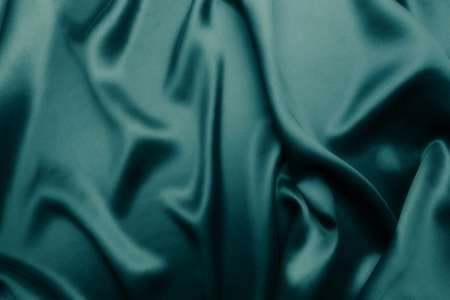 Elegant blue satin silk with waves, abstract backgroundの写真素材