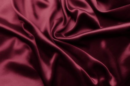 Elegant red satin silk with waves, abstract backgroundの写真素材