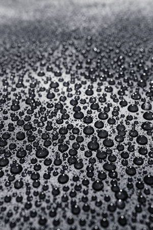 Water drops on a rough surface, texture backgroundの写真素材