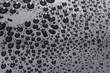 Water drops on a rough surface, texture backgroundの写真素材