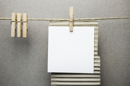 Paper note hanging on a rope with  clothespinsの写真素材