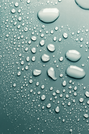 Rain drops on smooth surface, abstract backgroundの写真素材