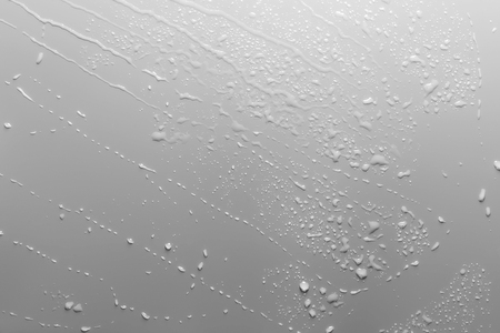 Surface with water drops, grey background	の写真素材