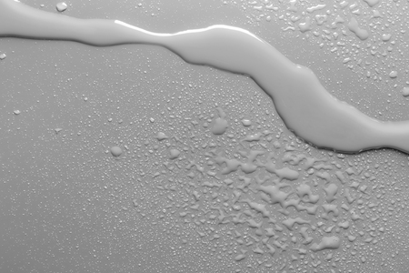 Surface with water drops, grey background	の写真素材