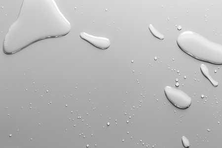 Surface with water drops, grey background	の写真素材