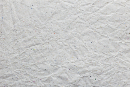 Crumpled recycled paper sheet; texture backgroundの写真素材