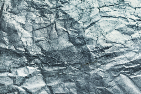 Sheet of silver paper crumpled, abstract backgroundの写真素材