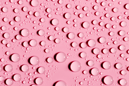 Drops of water on colorful surface, abstract backgroundの写真素材