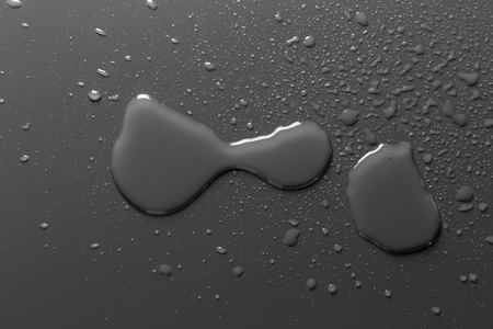 Surface with water drops, grey backgroundの写真素材