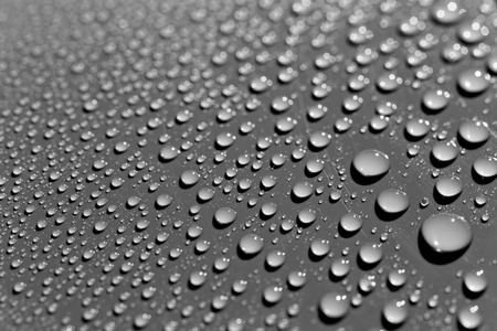 Raindrops on grey surface, abstract backgroundの写真素材