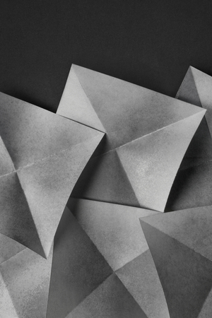 Abstract geometric of paper sheets folded in pyramidal shapesの写真素材