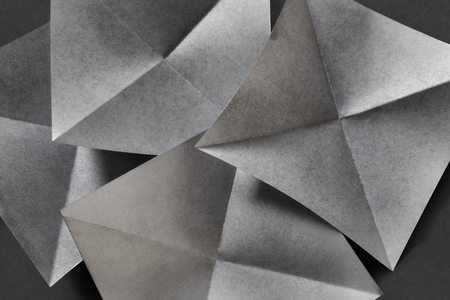 Abstract geometric of paper sheets folded in pyramidal shapesの写真素材