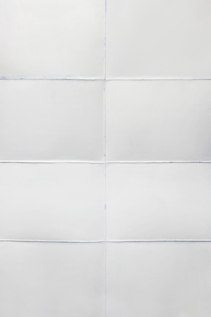 Empty sheet of paper folded in eight, white backgroundの写真素材