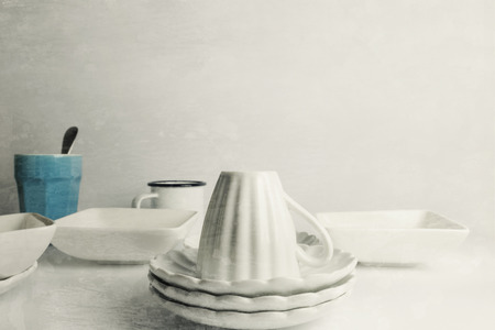White ceramic coffee cups, grunge texture backgroundの写真素材