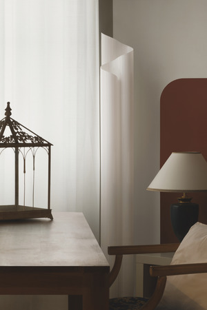 Interior of house, detail of the living room with lantern on wooden tableの写真素材