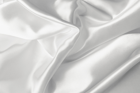Elegant white satin silk with waves, abstract backgroundの写真素材