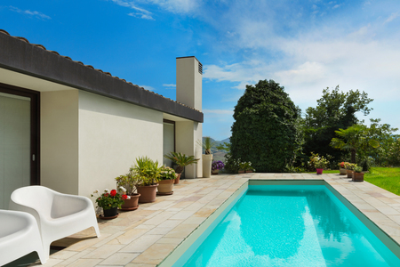 Architecture, white modern house with pool, blue skyの写真素材