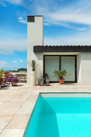 Detail of modern villa with swimming pool, view from the poolsideの写真素材