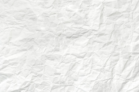 Crumpled white paper sheet, texture wrinkled backgroundの写真素材