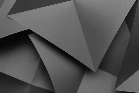 Composition with gray paper folded in geometric shapes, macro imageの写真素材