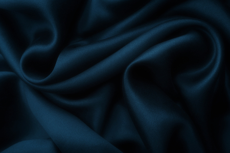 Elegant blue satin silk with waves, texture backgroundの写真素材