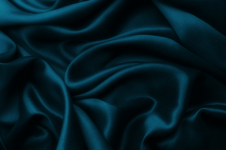 Elegant blue satin silk with waves, texture backgroundの写真素材