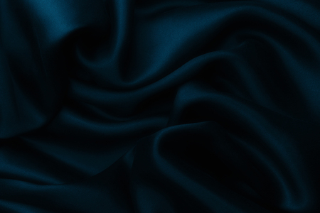 Elegant blue satin silk with waves, texture backgroundの写真素材