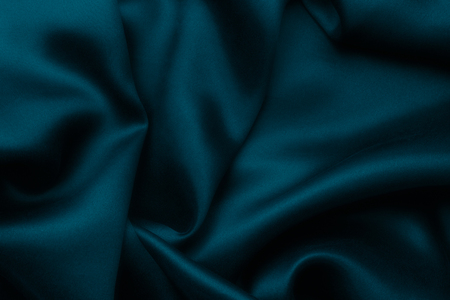 Elegant blue satin silk with waves, texture backgroundの写真素材