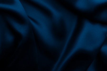 Elegant blue satin silk with waves, texture backgroundの写真素材