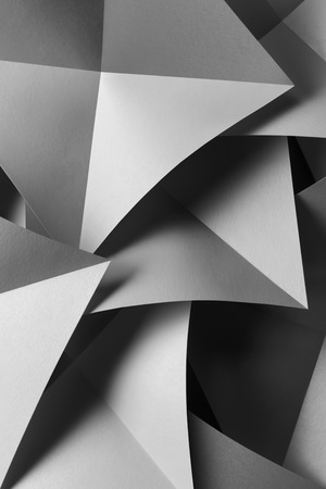 Composition with gray paper folded in geometric shapesの写真素材