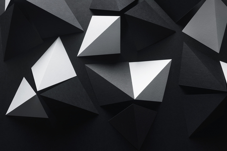 Geometric shapes of white and black paper, dark abstract backgroundの写真素材