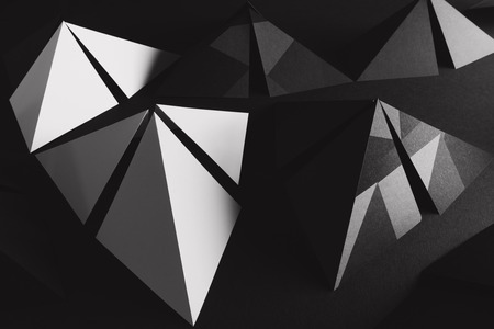 Creative image with architectural elements, pyramids on dark backgroundの写真素材