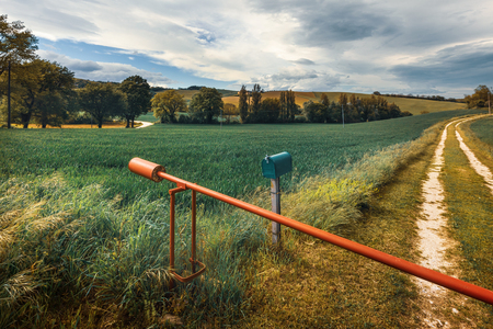 Beautiful rural landscape on spring, gate of farmの写真素材